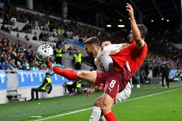 Ljubljana, Slovenia, October 13th 2025, Danijel Sturm of Slovenia (L) in action against Remo Freuler of Switzerland (R) during the UEFA European Qualifiers for 2026 World Cup, Group B match between Slovenia and Switzerland at Stadium Stozice, Ljubljana, Slovenia. (Photo by Natasa Kupljenik Sports Press Photo) Copyright: xNatasaxKupljenikx xSPPx Sportspressphoto_SPR42155