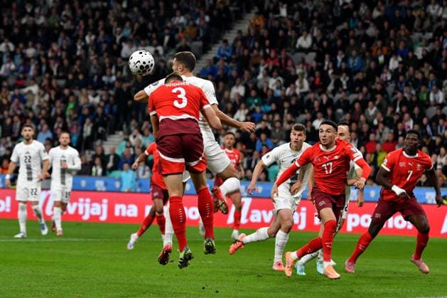 Ljubljana, Slovenia, October 13th 2025, Danijel Sturm of Slovenia (L) in action against Silvan Widmer of Switzerland (L) during the UEFA European Qualifiers for 2026 World Cup, Group B match between Slovenia and Switzerland at Stadium Stozice, Ljubljana, Slovenia. (Photo by Natasa Kupljenik Sports Press Photo) Copyright: xNatasaxKupljenikx xSPPx Sportspressphoto_SPR42159