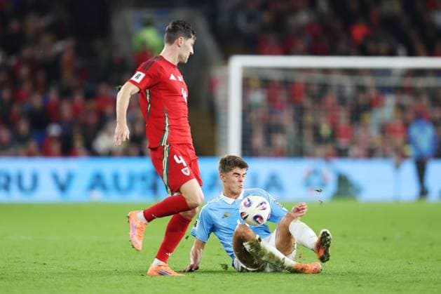 Wales v Belgium 13 October 2025, Cardiff - International Football - 2026 World Cup Qualifiers, Group J - Wales v Belgium - Ben Davies of Wales battles with Charles De Ketelaere of Belgium - Photo: Charlotte Wilson Offside. Cardiff UK Copyright: xCharlottexWilsonx xOffsidexOffside