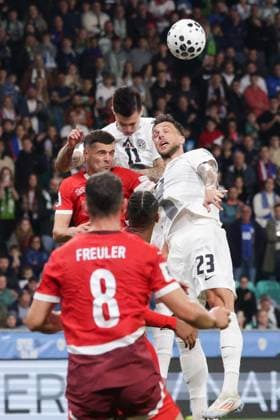 (251014) -- LJUBLJANA, Oct. 14, 2025 -- Benjamin Sesko (top) and David Brekalo (R) of Slovenia compete for a header with Granit Xhaka (L) of Switzerland during the World Cup 2026 European Qualifiers Group B football match between Slovenia and Switzerland in Ljubljana, Slovenia, Oct. 13, 2025. (Photo by Xinhua) (SP)SLOVENIA-LJUBLJANA-FOOTBALL FIFA World Cup, WM, Weltmeisterschaft, Fussball EUROPEAN QUALIFIERS-SLOVENIA VS SWITZERLAND ZeljkoxStevanic 