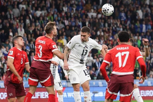 (251014) -- LJUBLJANA, Oct. 14, 2025 -- Erik Janza (C) of Slovenia competes for a header with Silvan Widmer of Switzerland (front 2nd L) during the World Cup 2026 European Qualifiers Group B football match between Slovenia and Switzerland in Ljubljana, Slovenia, Oct. 13, 2025. (Photo by Xinhua) (SP)SLOVENIA-LJUBLJANA-FOOTBALL FIFA World Cup, WM, Weltmeisterschaft, Fussball EUROPEAN QUALIFIERS-SLOVENIA VS SWITZERLAND ZeljkoxStevanic 