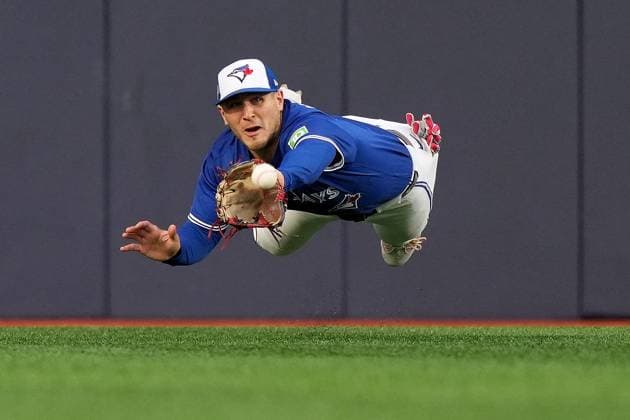 October 13, 2025, Toronto, On, CANADA: Toronto Blue Jays outfielder Daulton Varsho (5) makes a catch to out Seattle Mariners third baseman Eugenio SuoÂ¡rez (28) during third inning MLB, Baseball Herren, USA American League Championship Series game 2 baseball in Toronto, Monday, Oct. 13, 2025. Canada News - October 13, 2025  - ZUMAc35_ 20251013_zaf_c35_081 Copyright: xNathanxDenettex