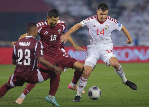 UQATAR v NITED ARAB EMIRATES-2026 FIFA World Cup, WM, Weltmeisterschaft, Fussball ASIAN QUALIFIER PLAYOFFS Boualem Khoukhi (C) of Qatar and Nicolas Gimenez of United Arab Emirates in action during the FIFA World Cup 2026 AFC Asian qualifiers playoffs group A match between Qatar and United Arab Emirates at Jassim Bin Hamad Stadium in Doha, Qatar, on October 14, 2025. DOHA Qatar Copyright: xNOUSHADx
