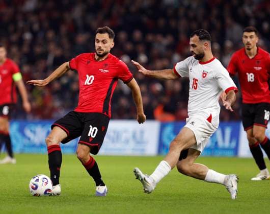 Albania vs Jordan friendly match, Tirana, Albania on October 14, 2025. Albania s Nedim Bajrami (L) and Ibrahim Sadeh (R) fight for the ball during a friendly football match between Albania and Jordan at the Air Albania Stadium in Tirana on October 14, 2025. TIRANE ALBANIA Copyright: xMALTONxDIBRAx