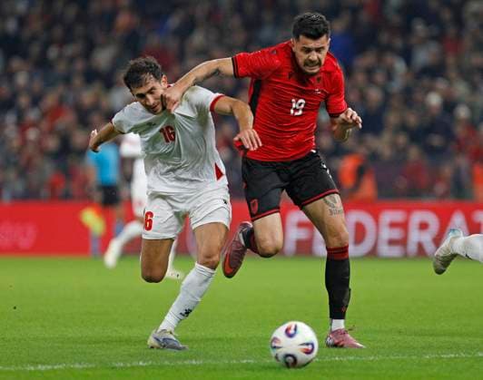 Albania vs Jordan friendly match, Tirana, Albania on October 14, 2025. Albania s Mirlind Daku (R) and Mohammad Abualnadi (L) fight for the ball during a friendly football match between Albania and Jordan at the Air Albania Stadium in Tirana on October 14, 2025. TIRANE ALBANIA Copyright: xMALTONxDIBRAx