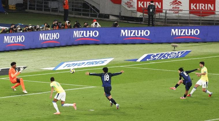 Football: Friendly between Japan and Brazil Japan s Takumi Minamino (2nd from R) scores in the second half of an international football friendly against Brazil at Ajinomoto Stadium in Chofu, Tokyo, on Oct. 14, 2025.  A14AA0004942050P