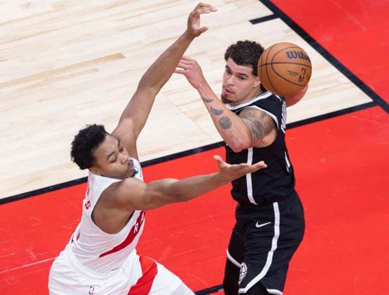(251018) -- TORONTO, Oct. 18, 2025 -- Scottie Barnes (L) of Toronto Raptors vies with Michael Porter Jr. of Brooklyn Nets during the 2025-2026 NBA, Basketball Herren, USA preseason game between Toronto Raptors and Brooklyn Nets in Toronto, Canada, on Oct. 17, 2025. (Photo by Xinhua) (SP)CANADA-TORONTO-NBA-PRESEASON-NETS VS RAPTORS ZouxZheng 