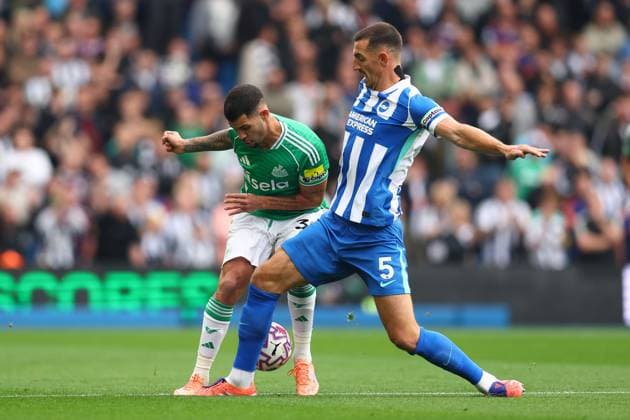 Brighton and Hove, England, 18th October 2025. Bruno Guimaraes of Newcastle United and Lewis Dunk of Brighton and Hove Albion challenge for the ball during the Brighton and Hove Albion vs Newcastle United Premier League match at the AMEX Stadium, Brighton and Hove. Picture credit should read: Paul Terry Sportimage EDITORIAL USE ONLY. No use with unauthorised audio, video, data, fixture lists, club league logos or live services. Online in-match use limited to 120 images, no video emulation. No use in betting, games or single club league player publications. SPI_017_PT_Brighton_Newcastle SPI-4218-0017