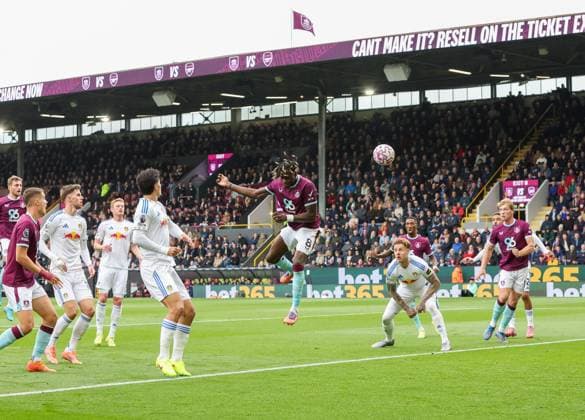Burnley, England, 18th October 2025. Lesley Ugochukwu (C) of Burnley heads to score the first goal during the Burnley vs Leeds United Premier League match at Turf Moor, Burnley. Picture credit should read: Nigel Roddis Sportimage EDITORIAL USE ONLY. No use with unauthorised audio, video, data, fixture lists, club league logos or live services. Online in-match use limited to 120 images, no video emulation. No use in betting, games or single club league player publications. SPI_003_NR_BURN_LEED SPI-4219-0003