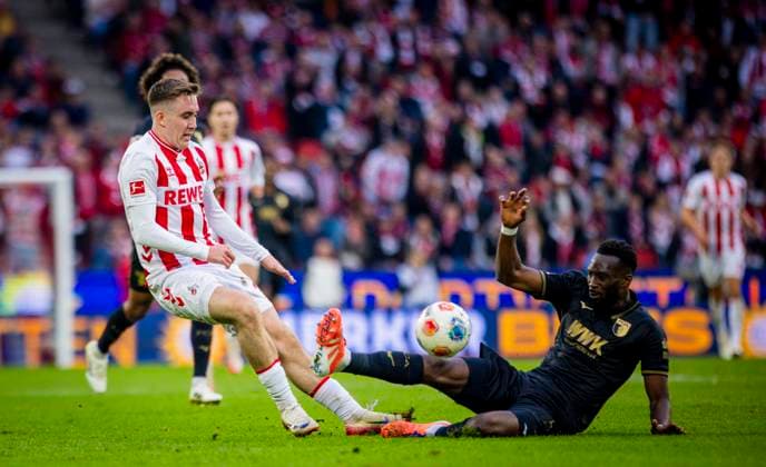 Cologne, Germany. 18th Oct 2025. . Isak Johannesson (Köln) Samuel Essende (Augsburg) 1. FC Köln - FC Augsburg 18.10.2025