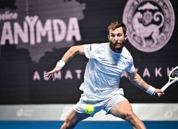 (251019) -- ALMATY, Oct. 19, 2025 -- Corentin Moutet of France hits a return during the men s singles semifinal match against Alex Michelsen of the United States at the ATP, Tennis Herren 250 Almaty Tennis Open in Almaty, Kazakhstan, on Oct. 18, 2025. ) (SP)KAZAKHSTAN-ALMATY-TENNIS-ALMATY OPEN-SEMIFINAL LixRenzi 