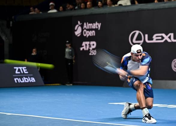 (251019) -- ALMATY, Oct. 19, 2025 -- James Duckworth of Australia hits a return during the men s singles semifinal match against Daniil Medvedev of Russia at the ATP250 Almaty Tennis Open in Almaty, Kazakhstan, on Oct. 18, 2025. ) (SP)KAZAKHSTAN-ALMATY-TENNIS-ALMATY OPEN-SEMIFINAL LixRenzi 