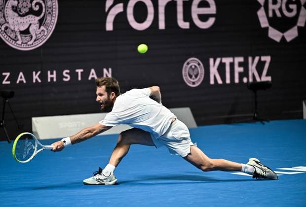 (251019) -- ALMATY, Oct. 19, 2025 -- Corentin Moutet of France hits a return during the men s singles semifinal match against Alex Michelsen of the United States at the ATP, Tennis Herren 250 Almaty Tennis Open in Almaty, Kazakhstan, on Oct. 18, 2025. ) (SP)KAZAKHSTAN-ALMATY-TENNIS-ALMATY OPEN-SEMIFINAL LixRenzi 