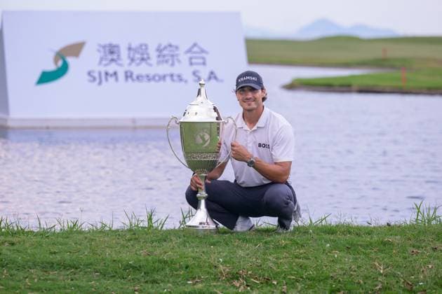 October 19, 2025, Macao, Macao Sar, China: Macau Open Golf , Final Round, Macau Golf and Country Club Coloane, Macao, China . GermanyÃ¢â‚¬â ¢s Dominic Foos Wins the Macau Open Golf after a tiebreaker with Taiwans Wang, Wei-hsuan. Foos holds the cup by the lake on the 18th fairway. Macao China - ZUMAr144 20251019_zap_r144_011 Copyright: xJaynexRussellx