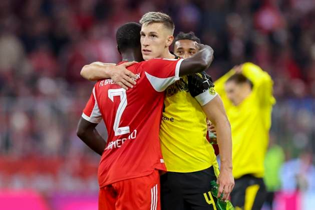 Dayot Upamecano (FC Bayern Muenchen) und Nico Schlotterbeck (Borussia Dortmund) umarmen sich, Bundesliga, FC Bayern München v Borussia Dortmund, Allianz Arena am 18. October 2025 in München, Deutschland. (Foto von Marco Steinbrenner DeFodi Images) Dayot Upamecano (FC Bayern Muenchen) und Nico Schlotterbeck (Borussia Dortmund) hugh each other, Bundesliga, FC Bayern München v Borussia Dortmund, Allianz Arena, October 18, 2025 in München, Germany. (Photo by Marco Steinbrenner DeFodi Images) DFL regulations prohibit any use of photographs as image sequences and or quasi-video. Dayot Upamecano FC Bayern Muenchen and Nico Schlotterbeck Borussia Dortmund hug each other, Bundesliga, FC Bayern München v Borussia Dortmund, Allianz Arena, October 18, 2025 in Munich, Germany Photo by Marco Steinbrenner DeFodi Images Dayot Upamecano FC Bayern Muenchen and Nico Schlotterbeck Borussia Dortmund hug each other, Bundesliga, FC Bayern München v Borussia Dortmund, Allianz Arena, October 18, 2025 in München, Germany Photo by Marco Steinbrenner DeFodi Images DFL regulations prohibit any use of photographs as image sequences and or quasi video