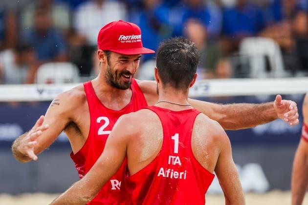 (251019) -- LAGUNA PROVINCE, Oct. 19, 2025 -- Alex Ranghieri (Back) and Manuel Alfieri of Italy celebrate after winning the men s bronze medal match between Manuel Alfieri Alex Ranghieri of Italy and Christoph Dressler Philipp Waller of Austria at the Volleyball World Beach Pro Tour in Laguna Province, the Philippines, Oct. 19, 2025. ) (SP)PHILIPPINES-LAGUNA PROVINCE-VOLLEYBALL-WORLD BEACH PRO TOUR ROUELLExUMALI 