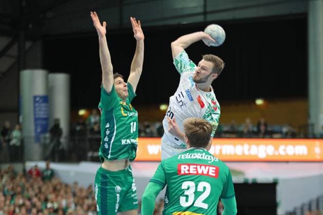 Handball DAIKIN HBL: SC DHfK Leipzig - SC Magdeburg; 19.10.2025 Philipp Weber (20, SC Magdeburg) wirft gegen Marko Mamic (14, SC DHfK Leipzig). Handball, DAIKIN HBL, 1. Bundesliga, Saison 2025 2026, 9. Spieltag: SC DHfK Leipzig vs. SC Magdeburg am 19.10.2025 in der Quarterback Immobilien Arena Leipzig. Copyright: xBEAUTIFULxSPORTS JanxKaeferx