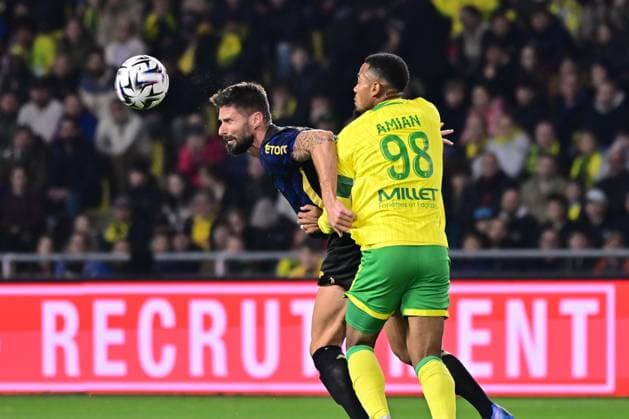 FOOTBALL : Nantes vs Lille - Ligue 1 - 19 10 2025 Olivier Giroud ( 9 - Lille ) and Kelvin Amian Adou ( 98 - Nantes )during the Ligue 1match between FC Nantes and Lille OSC at Stade de la Beaujoire on October 19, 2025 in Nantes, France. ( Photo by Federico Pestellini PsnewZ ) - NantesFrance  Copyright: xFedericoxPestellinix