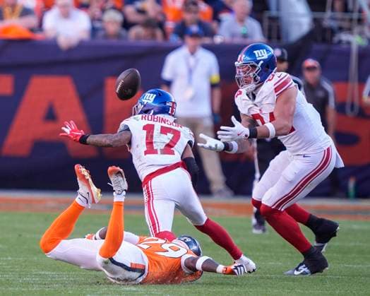 October 19, 2025: New York Giants tight end Theo Johnson (84) is Johnny on the spot to catch a deflection intended for teammate New York Giants wide receiver Wan Dale Robinson (17) in the second half of the football game between the Denver Broncos and New York Giants. Johnson scored after making the catch. CSM. - ZUMAc04_ 20251019_zma_c04_304 Copyright: xDerekxRegensburgerx