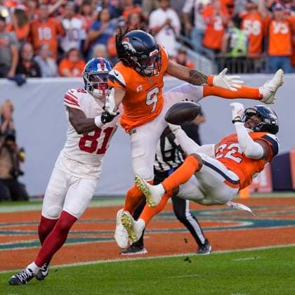 October 19, 2025: Denver Broncos safety Brandon Jones (22) and Denver Broncos safety Talanoa Hufanga (9) break up a pass intended for New York Giants wide receiver Beaux Collins (81) in the second half of the football game between the Denver Broncos and New York Giants. CSM. - ZUMAc04_ 20251019_zma_c04_319 Copyright: xDerekxRegensburgerx