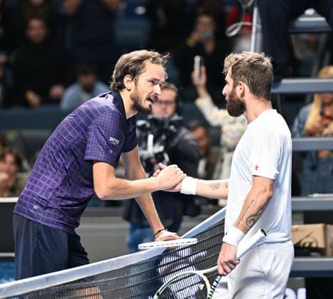 (251020) -- ALMATY, Oct. 20, 2025 -- Daniil Medvedev (L) of Russia shakes hands with Corentin Moutet of France after their men s singles final match at the ATP250 Almaty Tennis Open in Almaty, Kazakhstan, on Oct. 19, 2025. ) (SP)KAZAKHSTAN-ALMATY-TENNIS-ALMATY OPEN--FINAL LixRenzi 