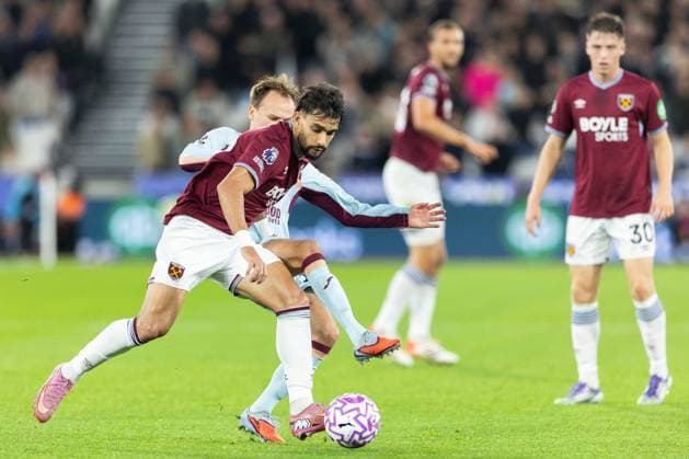 20th October 2025; London Stadium, London, England; Premier League Football, West Ham United versus Brentford; Lucas Paquet& xe1; of West Ham United battles past Sepp van den Berg of Brentford  IanxStephen