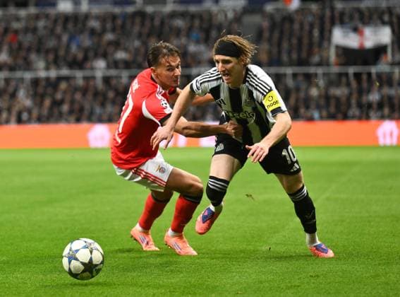 Anthony Gordon of Newcastle United goes past Amar Dedic of Benfica Newcastle United v Benfica, UEFA Champions League, Group Stage, Football, St James Park, Newcastle, UK - 21 Oct 2025Newcastle St James Park United Kingdom EDITORIAL USE ONLY No use with unauthorised audio, video, data, fixture lists, club league logos or live services. Online in-match use limited to 120 images, no video emulation. No use in betting, games or single club league player publications. Copyright: xRichardxLee Shutterstockx 15552303v