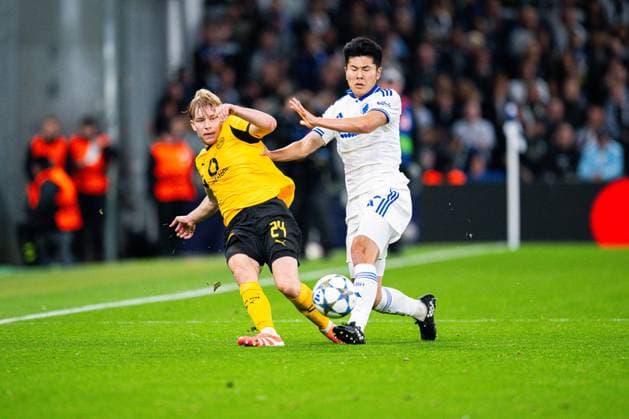 21.10.2025 - Fußball, 2025 2026, Champions League, 3. Spieltag, FC Kopenhagen - Borussia Dortmund: (L-R) Daniel Svensson (Dortmund), Junnosuke Suzuki (Kopenhagen)