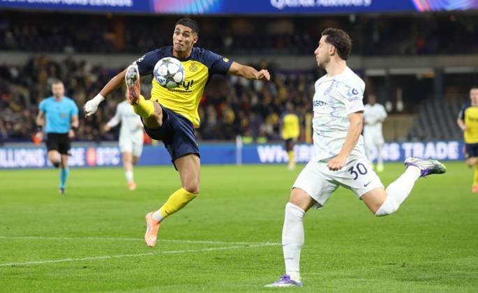 Union s Anan Khalaili and Inter s Carlos Augusto fight for the ball during a soccer game between Belgian Royale Union Saint-Gilloise and Italian Internazionale Milano, Tuesday 21 October 2025 in Brussels, on the third day of the League phase of the UEFA Champions League tournament. VIRGINIExLEFOUR  x137538940x