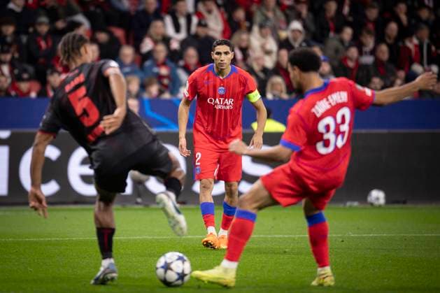 UEFA Champions League, Bayer 04 Leverkusen vs. Paris Saint-Germain, 21.10.2025 LEVERKUSEN, GERMANY - OCTOBER 21: Loic Bade (Bayer 04 Leverkusen, 5), Achraf Hakimi (Paris St. Germain, 2), Warren Zaire-Emery (Paris St. Germain, 33) during the UEFA Champions League match on gameday 3 between Bayer 04 Leverkusen vs. Paris Saint-Germain at BayArena on October 21, 2025 in Leverkusen, Germany. DFL REGULATIONS PROHIBIT ANY USE OF PHOTOGRAPHS AS IMAGE SEQUENCES AND OR QUASI-VIDEO. Copyright: xBEAUTIFULxSPORTS AxelxKohringx