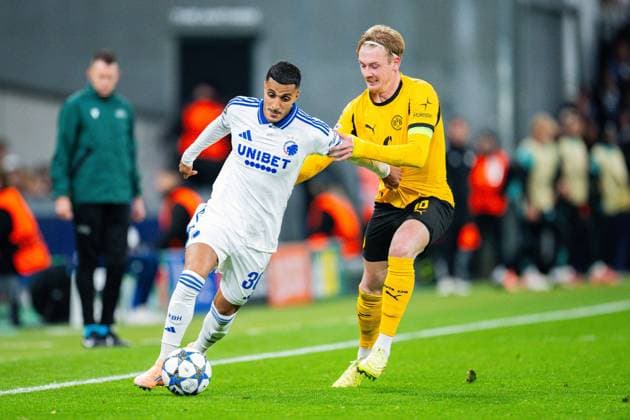 21.10.2025 - Fußball, 2025 2026, Champions League, 3. Spieltag, FC Kopenhagen - Borussia Dortmund: (L-R) Elias Achouri (Kopenhagen), Julian Brandt (Dortmund)