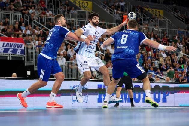 HC Zagreb v OTP Bank Pick Szeged: EHF Champions League Imanol Garciandia of Pick Szeged plays a ball whilst under pressure from Jakov Gojun of HC Zagreb during the Men s EHF Champions League group B match between HC Zagreb and OTP Bank Pick Szeged at Arena Zagreb on October 22, 2025. in Zagreb, Croatia.  IgorxKralj PIXSELL