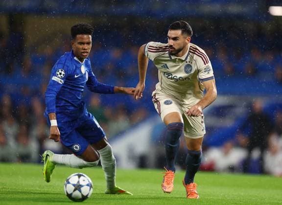 London, England, 22nd October 2025. Estevao of Chelsea and Josip Sutalo of Ajax during the Chelsea vs Ajax UEFA Champions League match at Stamford Bridge, London. Picture credit should read: Paul Terry Sportimage EDITORIAL USE ONLY. No use with unauthorised audio, video, data, fixture lists, club league logos or live services. Online in-match use limited to 120 images, no video emulation. No use in betting, games or single club league player publications. SPI_013_PT_Chelsea_Ajax SPI-4230-0013