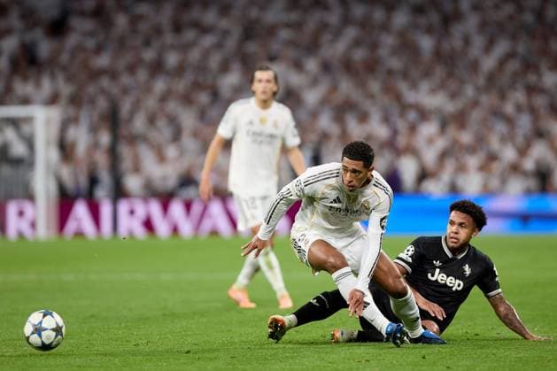 Jude Bellingham of Real Madrid CF and Weston Mckennie of Juventus FC Real Madrid v Juventus, UEFA Champions League, Football, Estadio Santiago Bernabeu, Madrid, Spain - 22 Oct 2025Madrid Estadio Santiago Bernabu Spain EDITORIAL USE ONLY No use with unauthorised audio, video, data, fixture lists, club league logos or live services. Online in-match use limited to 120 images, no video emulation. No use in betting, games or single club league player publications. Copyright: xRubenxAlbarran Shutterstockx 15564869aq
