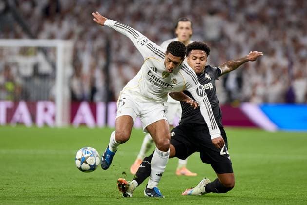 Jude Bellingham of Real Madrid CF and Weston Mckennie of Juventus FC Real Madrid v Juventus, UEFA Champions League, Football, Estadio Santiago Bernabeu, Madrid, Spain - 22 Oct 2025Madrid Estadio Santiago Bernabu Spain EDITORIAL USE ONLY No use with unauthorised audio, video, data, fixture lists, club league logos or live services. Online in-match use limited to 120 images, no video emulation. No use in betting, games or single club league player publications. Copyright: xRubenxAlbarran Shutterstockx 15564869at