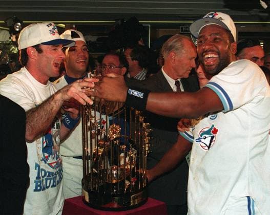 October 23, 1993, Toronto, On, Canada: Toronto Blue Jays Paul Molitor, left, and Joe Carter, right, stands with the World Series trophy in the Jays clubhouse after defeating the Philadelphia Phillies 8-6 to wine Game 6 and their second straight World Series 4 games to 3 Saturday, Oct. 23, 1993, at SkyDome in Toronto. Molitor was named MVP was named MVP for the series. Next to Molitor is Blue Jays Roberto Alomar. (CP PHOTO ) MOLITOR CARTER  - ZUMAc35_ 19931023_zaf_c35_001 Copyright: xFrankxGunnx