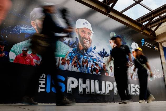 International Series golf in the Philippines People walk past a poster with the image of Dustin Johnson of the USA during the International Series Philippines in Sta. Elena Golf & Country Club, Laguna, south of Manila, Philippines on October 23, 2025. The tournament will run from October 23 to 26, 2025. LAGUNA PHILIPPINES  Copyright: xMatrixxImages MarkxCristinox