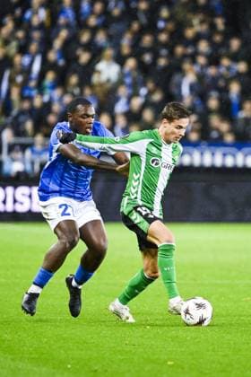 Genk s Ken Nkuba and 17? Real Betis s Rodrigo? Riquelme pictured in action during a soccer game between Belgian soccer team KRC Genk and Spanish club Real Betis Balompie, on Thursday 23 October 2025, in Genk, third game (out of 8) in the league phase of the UEFA Europa League competition. TOM GOYVAERTS TomxGoyvaerts  x137722128x