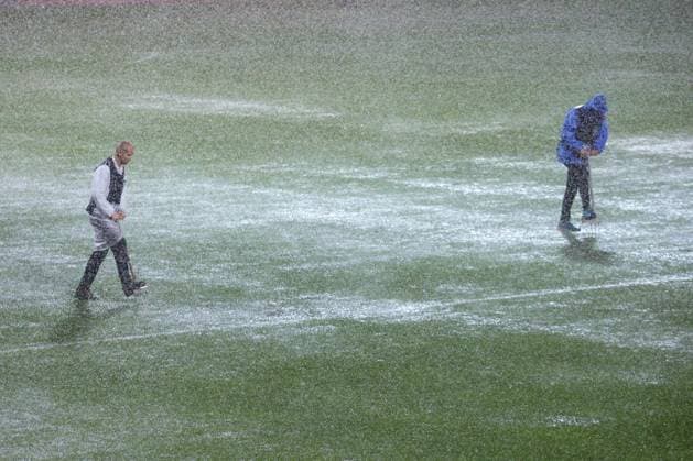 HNK Rijeka v AC Sparta Praha: UEFA Conference League A groundsmen attempts to release water from the waterlogged pitch after play is suspended due to heavy rain during the UEFA Conference League group phase matchday 2 between HNK Rijeka and AC Sparta Praha at HNK Rijeka Stadium on October 23, 2025. in Rijeka, Croatia.  NelxPavletic PIXSELL