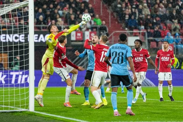 2025-10-23 AZ Alkmaar v Slovan Bratislava - UEFA Conference League 2025 26 League Phase MD2 ALKMAAR, NETHERLANDS - OCTOBER 23: Goalkeeper Dominik Takac of Slovan Bratislava makes a save during the UEFA Conference League 2025 26 League Phase MD2 match between AZ Alkmaar and Slovan Bratislava at AFAS Stadion on October 23, 2025 in Alkmaar, Netherlands. Alkmaar AFAS Stadion Netherlands Content not available for redistribution in The Netherlands directly or indirectly through any third parties. Copyright: xEdxvanxdexPolx