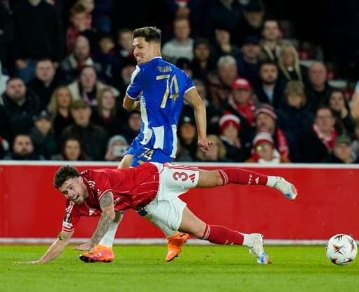 Nottingham, England, 23rd October 2025. NÄ›co Williams of Nottingham Forest tackled by Francisco Moura of FC Porto during the Nottingham Forest vs FC Porto UEFA Europa League match at the City Ground, Nottingham. Picture credit should read: Andrew Yates Sportimage EDITORIAL USE ONLY. No use with unauthorised audio, video, data, fixture lists, club league logos or live services. Online in-match use limited to 120 images, no video emulation. No use in betting, games or single club league player publications. SPI_039_AY_Forest_Porto SPI-4232-0039