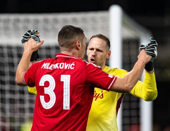 23rd October 2025; The City Ground, Nottingham, England; UEFA Europa League Football, Nottingham Forest versus Porto; Matz Sels of Nottingham Forest congratulates Nikola Milenkovic on making an important defensive tackle  GodfreyxPitt