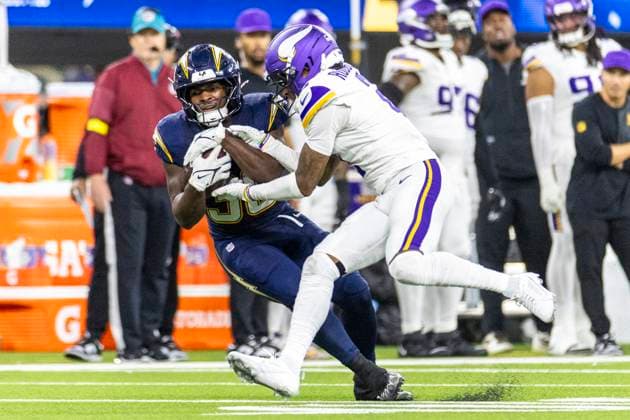 October 23, 2025, Los Angeles, California, USA: Los Angeles Chargers running back Kimani Vidal 30 is tackled by Minnesota Vikings cornerback Isaiah Rodgers 2 during an NFL, American Football Herren, USA football game at SoFi Stadium, Thursday Oct. 23, 2025, in Inglewood, Calif. Los Angeles USA - ZUMAc68_ 20251023_zaf_c68_015 Copyright: xRingoxChiux