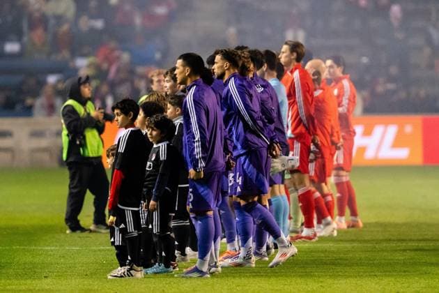 October 23, 2025, Bridgeview, Illinois, United States: Orlando City and Chicago Fire players line up for the National Anthem before the Chicago Fire FC vs Orlando City Wildcard match at SeatGeek Stadium. Final Score: Chicago Fire 3:1 Orlando City Bridgeview United States - ZUMAs197 20251023_aaa_s197_381 Copyright: xRajxChavdax