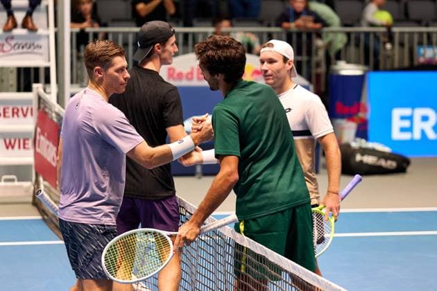 Francisco Cabral of Portugal and Lucas Miedler of Austria great Joe Salisbury and Neal Skupski of Great Britain at the net battery their the quarter-final win at Erste Bank Open 2025 at Marx Halle on October 24, 2025 in Vienna, Austria. (Photo by Camilla Stolen, Imago) Vienna Austria Copyright: xCamillaxStolenx L1073670