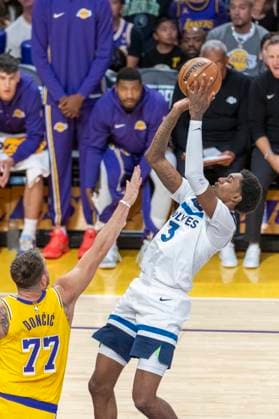 October 24, 2025, Los Angeles, California, USA: Minnesota Timberwolves Jaden McDaniels (3) shoots against Los Angeles LakersÃ¢â‚¬â ¢ Luka DonÄÂiÄ¡ (77) during an NBA, Basketball Herren, USA basketball game, in Los Angeles Friday, Oct. 24, 2025. Los Angeles USA - ZUMAc68_ 20251024_zaf_c68_011 Copyright: xRingoxChiux
