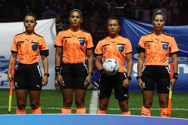 Brazilian referee Edna Alves (2nd-R) and assistants listen to the national anthems before the CONMEBOL Women s Nations League football match, qualifier for the 2027 World Cup in Brazil, between Argentina and Paraguay, at the Diego Armando Maradona stadium in Buenos Aires, Argentina on October 24, 2025. BUENOS AIRES ARGENTINA Copyright: xALEJANDROxPAGNIx