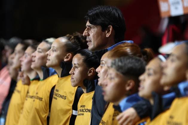 Argentina s head coach German Portanova (C) and players sing the national anthem before the CONMEBOL Women s Nations League football match, qualifier for the 2027 World Cup in Brazil, between Argentina and Paraguay, at the Diego Armando Maradona stadium in Buenos Aires, Argentina on October 24, 2025. BUENOS AIRES ARGENTINA Copyright: xALEJANDROxPAGNIx