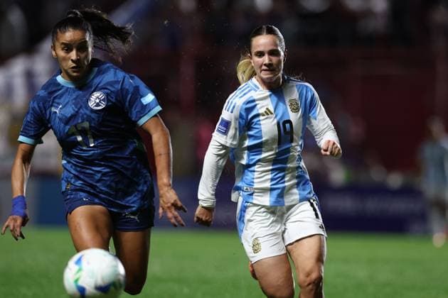 Paraguay s defender Camila Arrieta (L) and Argentina s midfielder Agostina Holzheier vie for the ball during the CONMEBOL Women s Nations League football match, qualifier for the 2027 World Cup in Brazil, between Argentina and Paraguay, at the Diego Armando Maradona stadium in Buenos Aires, Argentina on October 24, 2025. BUENOS AIRES ARGENTINA Copyright: xALEJANDROxPAGNIx