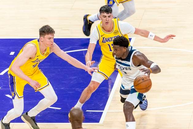 October 24, 2025, Los Angeles, California, USA: Minnesota Timberwolves Anthony Edwards (5) is defended by Los Angeles LakersÃ¢â‚¬â ¢ Dalton Knecht (4) and Jake LaRavia (12) during an NBA, Basketball Herren, USA basketball game, in Los Angeles Friday, Oct. 24, 2025. Los Angeles USA - ZUMAc68_ 20251024_zaf_c68_016 Copyright: xRingoxChiux
